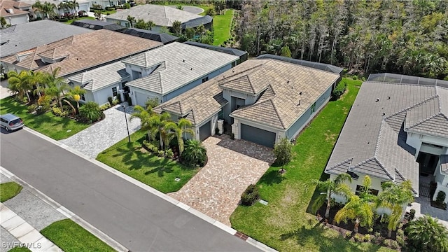 birds eye view of property with a residential view