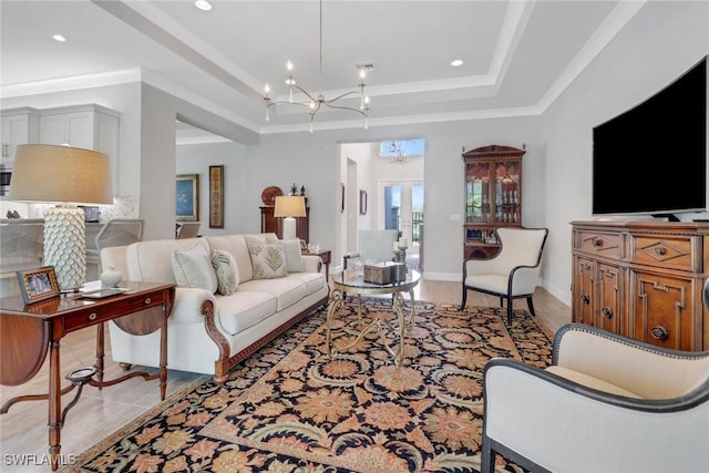 living area featuring a chandelier, recessed lighting, visible vents, baseboards, and a raised ceiling