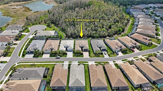 aerial view featuring a water view and a residential view