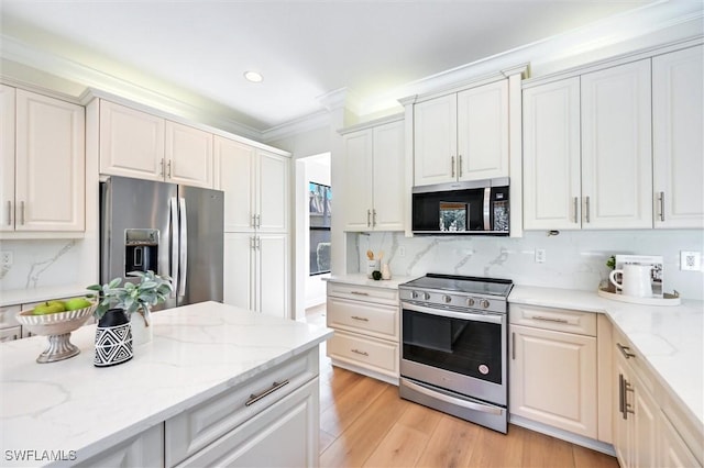 kitchen with appliances with stainless steel finishes, light wood-type flooring, crown molding, and tasteful backsplash