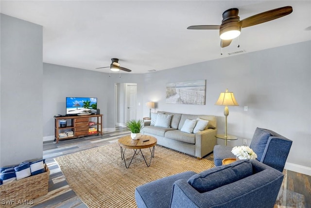 1416 SW 52nd Ter, Cape Coral, FL 33914 - living room with a ceiling fan, baseboards, and wood finished floors