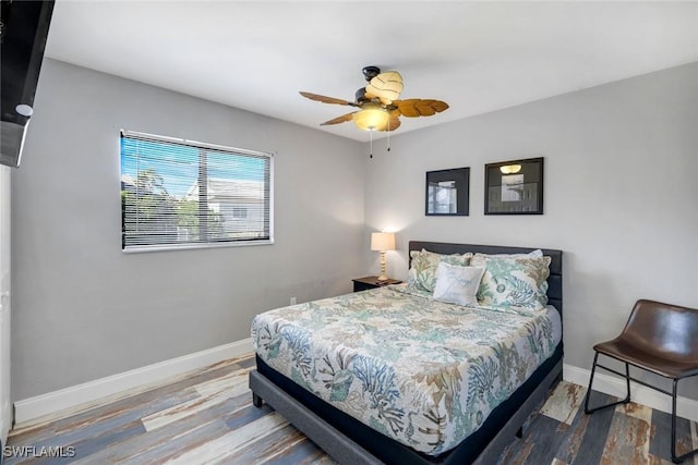 1416 SW 52nd Ter, Cape Coral, FL 33914 - bedroom with baseboards, wood finished floors, and a ceiling fan