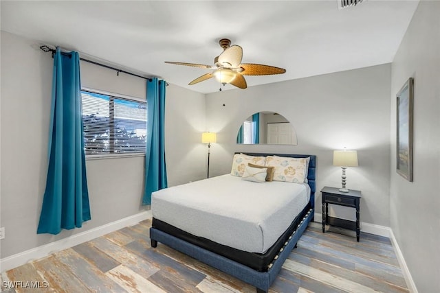 1416 SW 52nd Ter, Cape Coral, FL 33914 - bedroom with wood finished floors, baseboards, and a ceiling fan