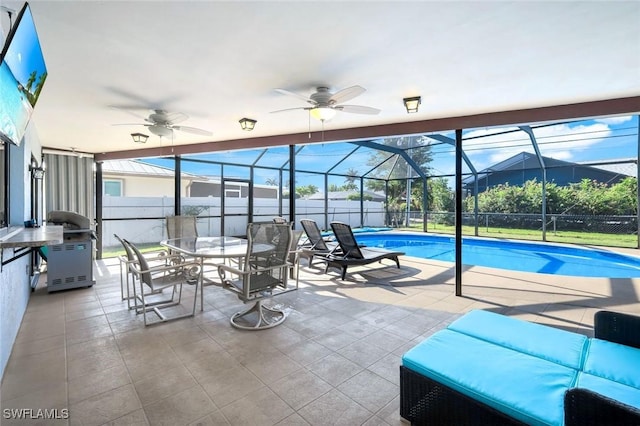 1416 SW 52nd Ter, Cape Coral, FL 33914 - view of pool featuring a ceiling fan, a patio, glass enclosure, and outdoor dining space