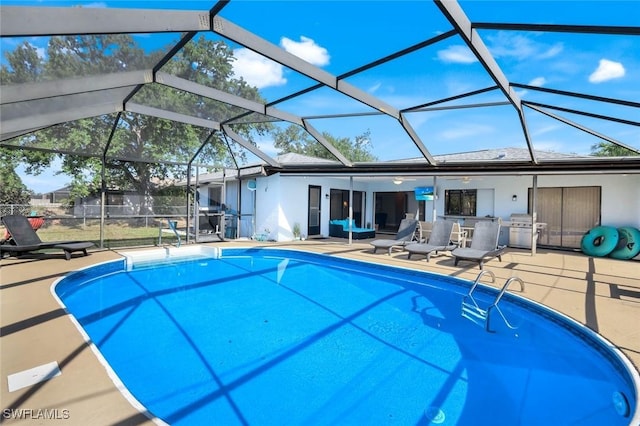 1416 SW 52nd Ter, Cape Coral, FL 33914 - outdoor pool with a patio, glass enclosure, and grilling area