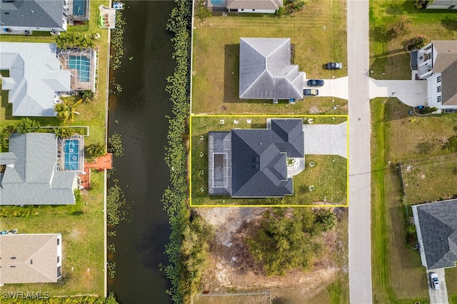 bird's eye view with a water view and a residential view