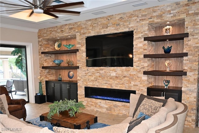 living area featuring ceiling fan, a stone fireplace, visible vents, and crown molding