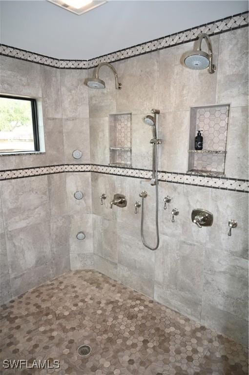 bathroom with a tile shower