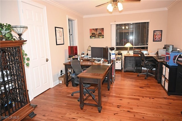 office area featuring baseboards, crown molding, a ceiling fan, and wood finished floors