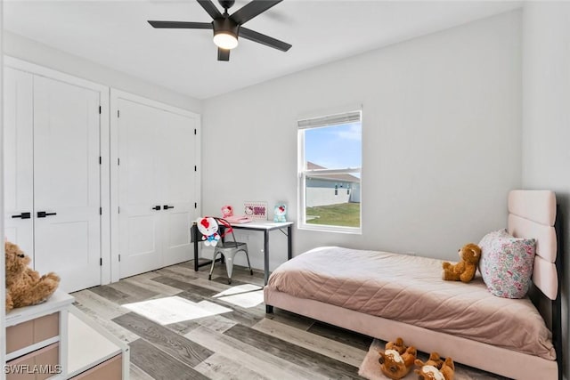 bedroom with light wood finished floors and ceiling fan