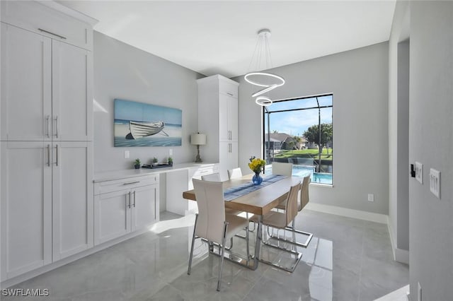 dining room featuring baseboards