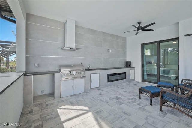 view of patio featuring a sink, a lanai, area for grilling, and ceiling fan