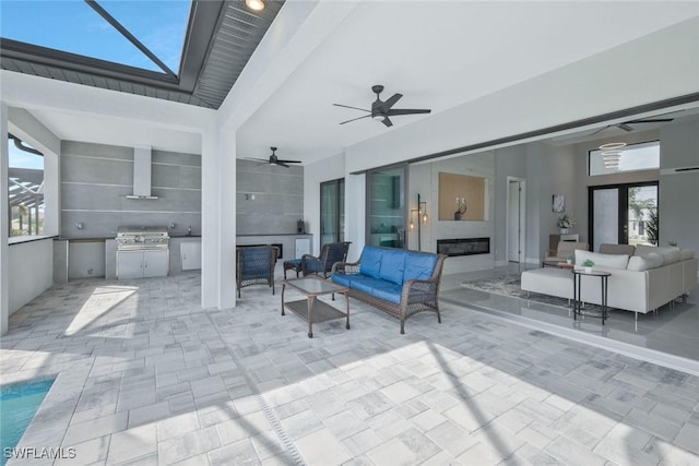 view of patio with grilling area, ceiling fan, a lanai, an outdoor hangout area, and area for grilling