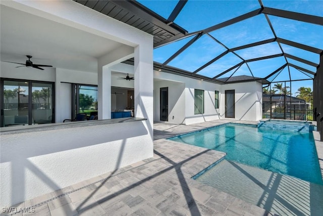 view of swimming pool featuring a patio area, a pool with connected hot tub, a lanai, and ceiling fan