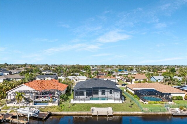 aerial view featuring a residential view and a water view