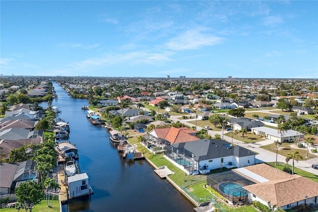 bird's eye view featuring a residential view and a water view