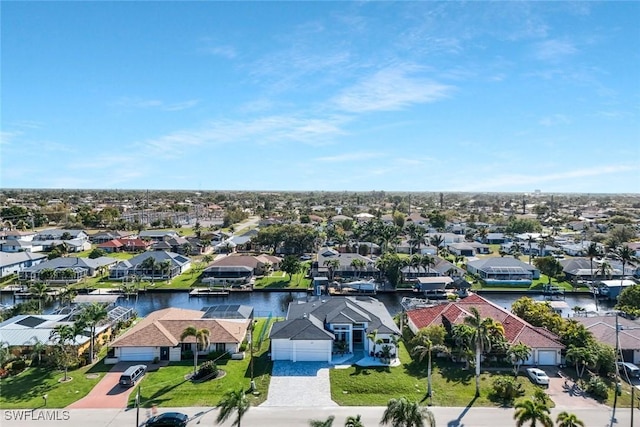 bird's eye view featuring a residential view and a water view