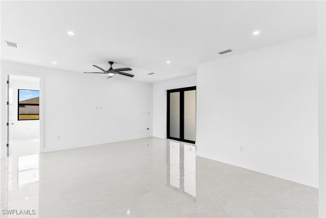 spare room featuring a ceiling fan, recessed lighting, and visible vents