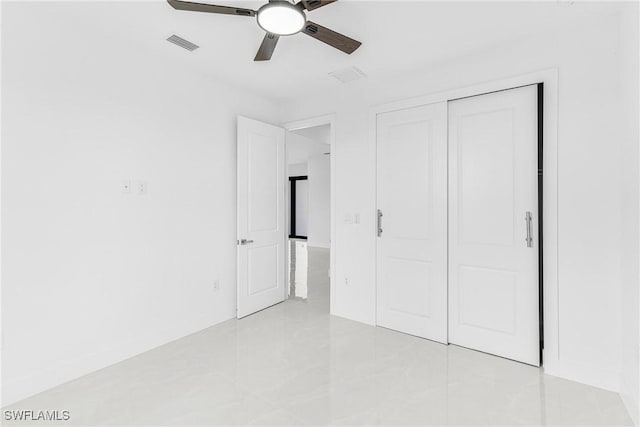 unfurnished bedroom with a closet, visible vents, and ceiling fan