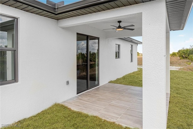 view of patio featuring a ceiling fan