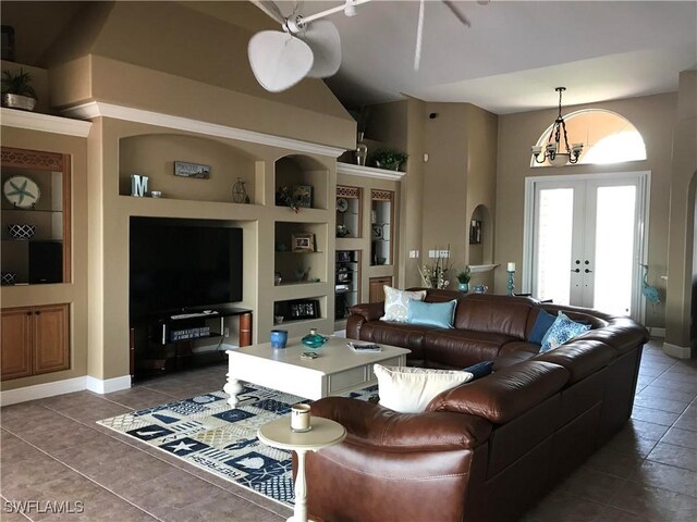 living room with baseboards, french doors, built in shelves, and tile patterned floors