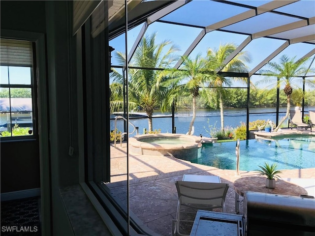 view of swimming pool featuring a water view and a pool with connected hot tub