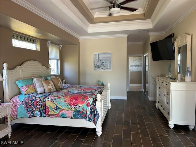 bedroom with ceiling fan, baseboards, ornamental molding, wood tiled floor, and a raised ceiling