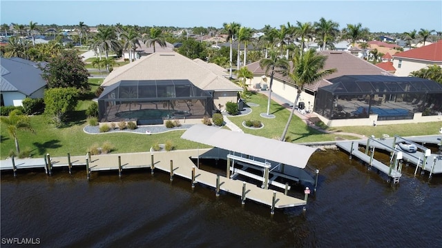 drone / aerial view featuring a water view and a residential view