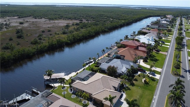 bird's eye view featuring a water view, a residential view, and a view of trees