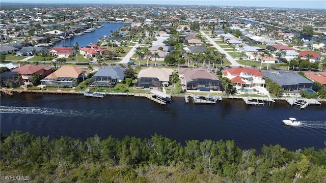 bird's eye view with a water view and a residential view