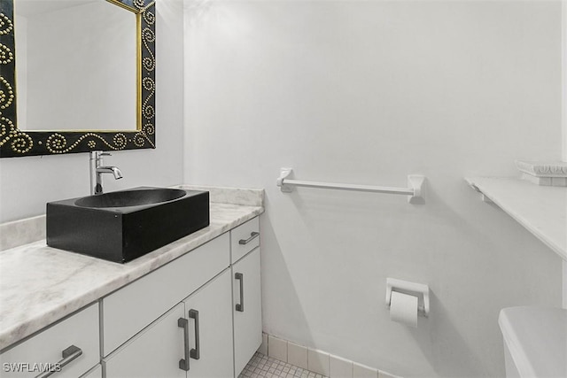 bathroom with tile patterned flooring and vanity