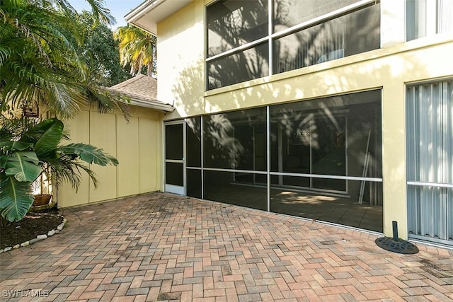 property entrance with a patio