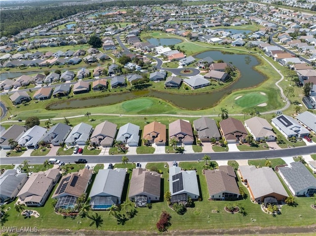 birds eye view of property with a residential view, view of golf course, and a water view