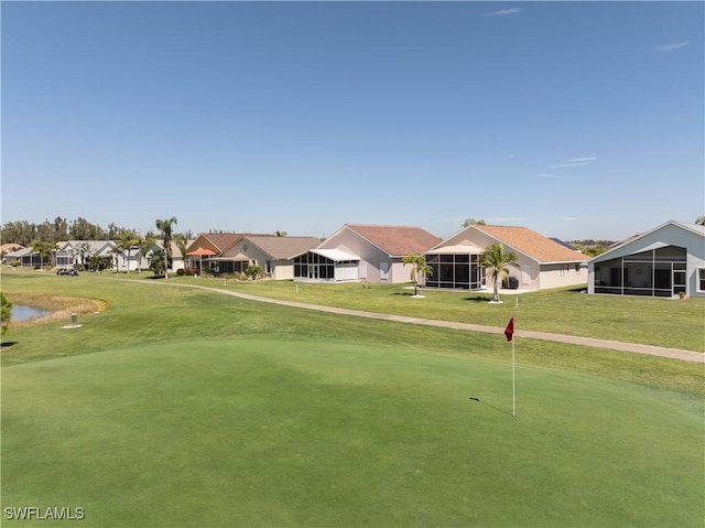 view of property's community with a yard and a residential view