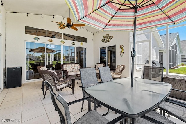 view of patio / terrace with a lanai, outdoor lounge area, and outdoor dining area