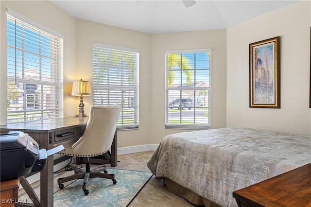 bedroom with baseboards and ceiling fan