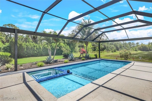 view of pool featuring glass enclosure, a lawn, a patio area, and a pool with connected hot tub