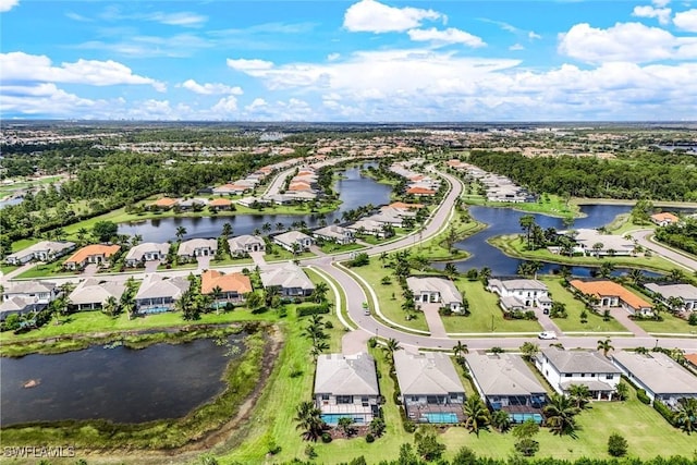 birds eye view of property featuring a water view and a residential view