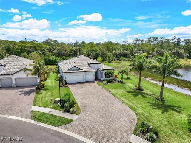 birds eye view of property with a water view