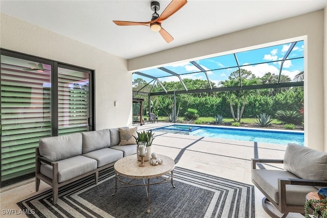 interior space featuring a healthy amount of sunlight, a sunroom, and a ceiling fan