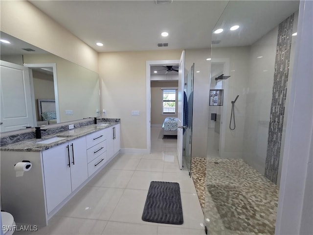 full bath with visible vents, connected bathroom, a sink, and a walk in shower