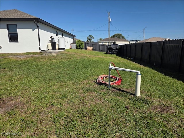 view of yard featuring a fenced backyard