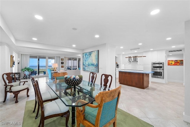 dining space with light tile patterned floors, recessed lighting, and baseboards