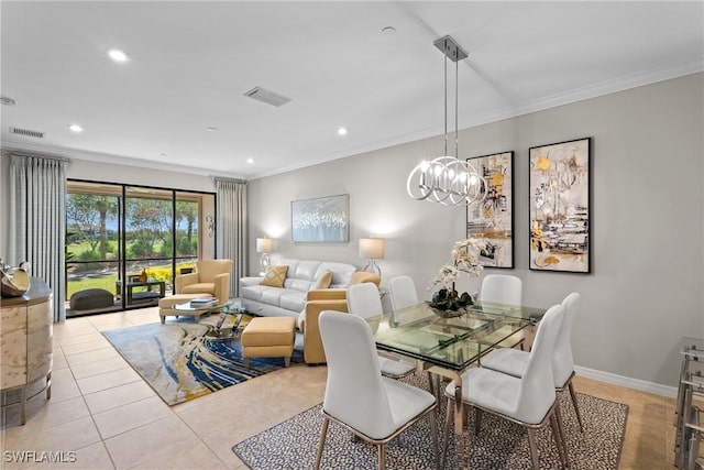 dining space featuring baseboards, visible vents, and crown molding