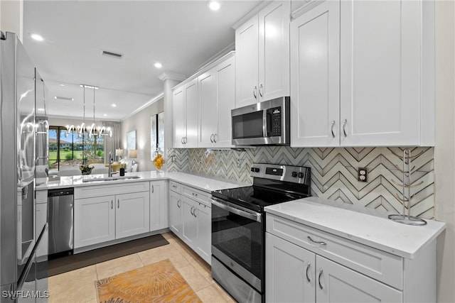 kitchen with light tile patterned floors, stainless steel appliances, tasteful backsplash, visible vents, and a sink