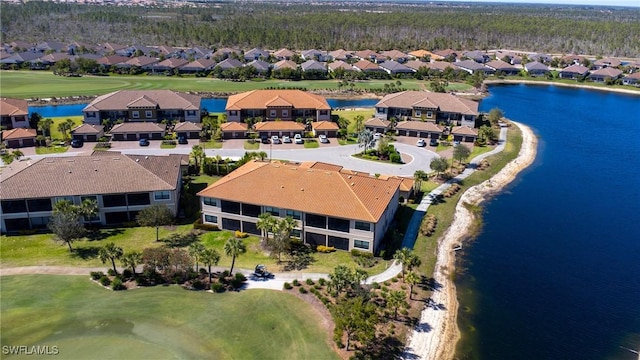 drone / aerial view featuring a water view and a residential view