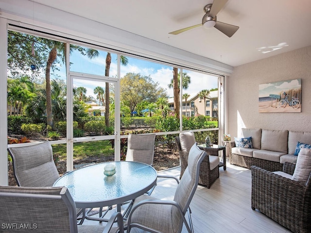 sunroom / solarium with ceiling fan