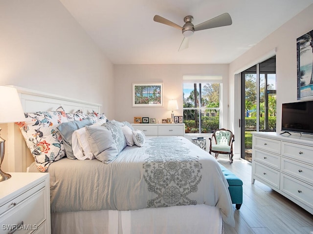 bedroom with wood finished floors, a ceiling fan, and access to outside