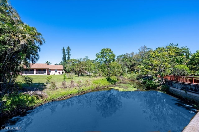 view of pool with a yard