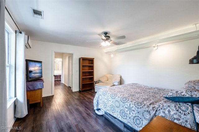 bedroom with visible vents, baseboards, wood finished floors, and a ceiling fan